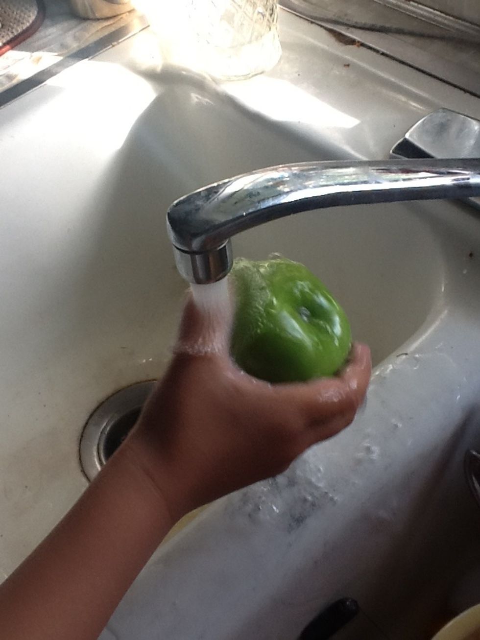 Next, you have to wash the apple. Dry it off afterwards.