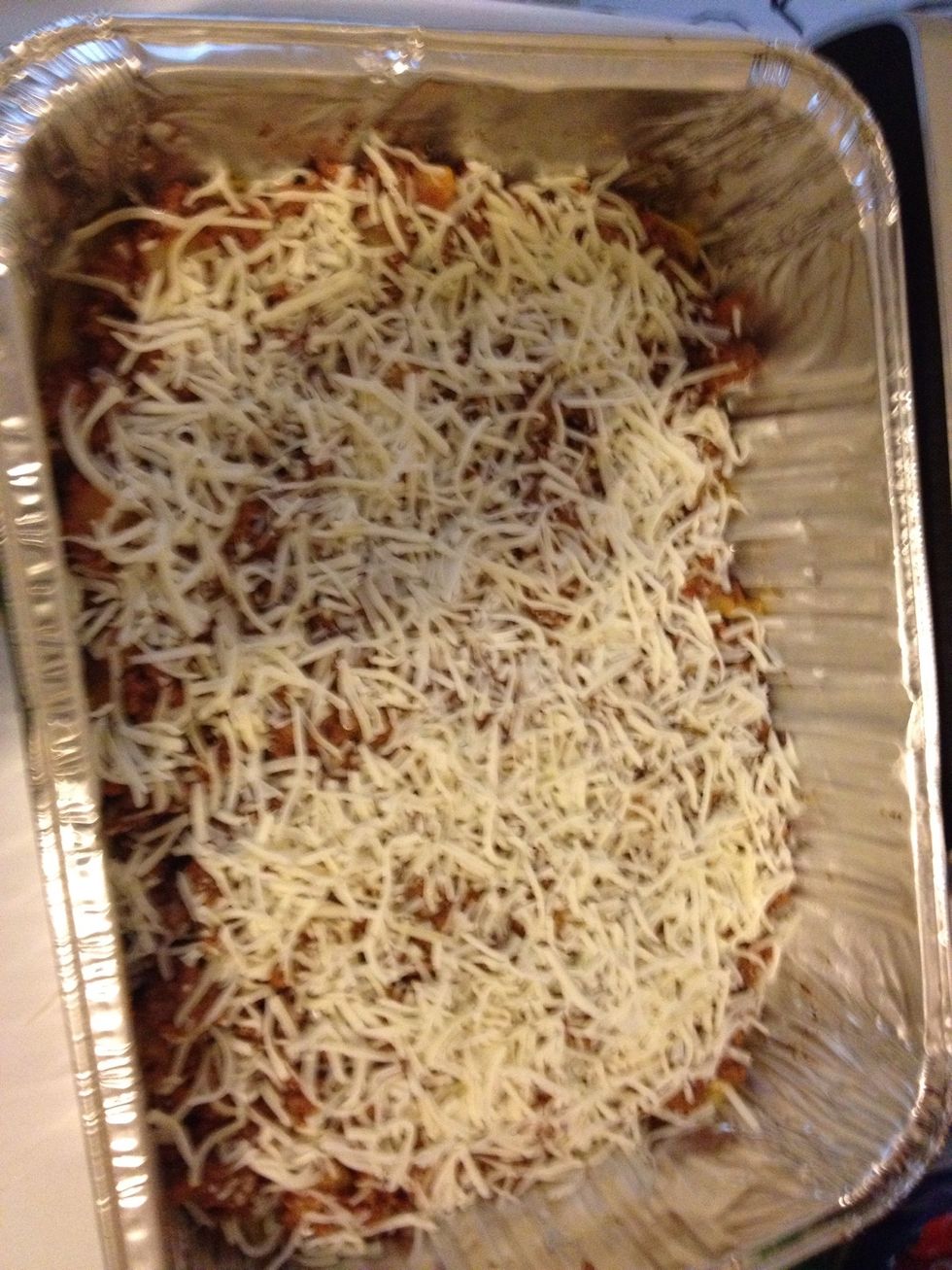 Next you'll add all of the meat and another layer of cheese. Then the leftover plantains will go on top of the cheese and another layer of cheese will go on top!