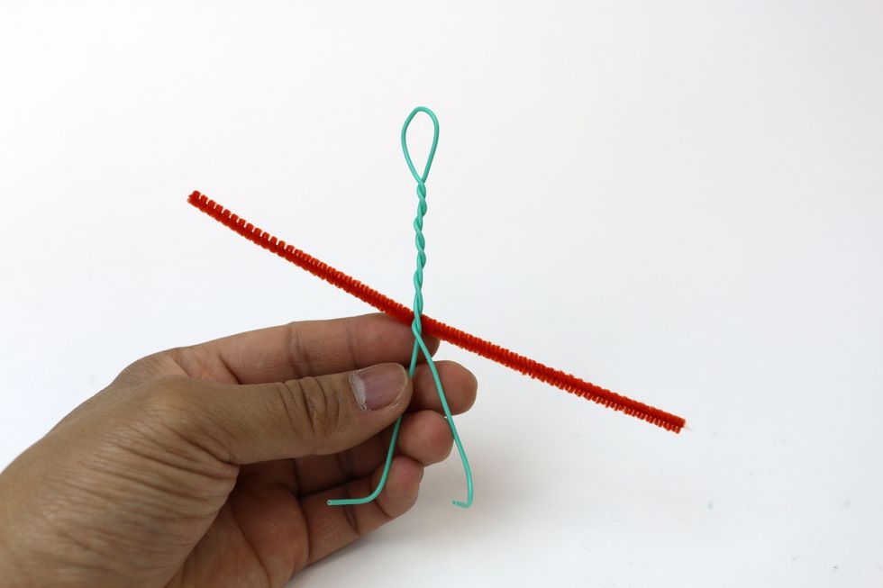 Next you'll get a pipe cleaner. We will use it to wrap the lower part of our figure.