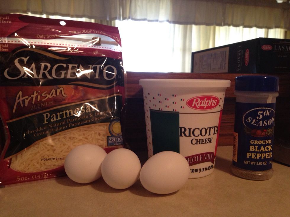 Next, you'll need two eggs, ricotta cheese, a cup of parmesan cheese and ground pepper