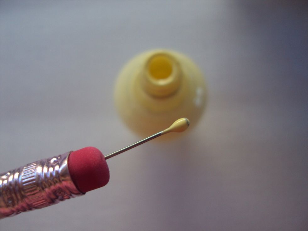 next you'll need yellow nail polish and a dotting tool. if you don't have one, watch my other guide on how to make a dotting tool!