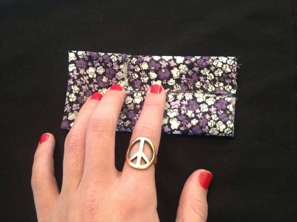 Next, you'll repeat the same process, this time folding the smaller edges in toward each other.