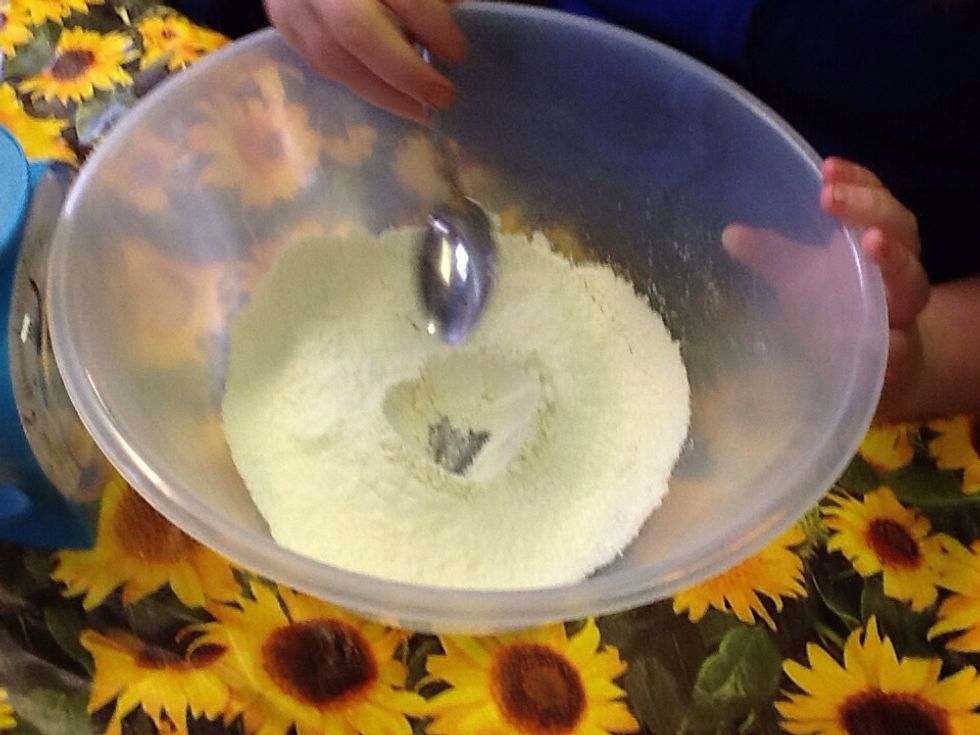 Next you make a little hole into the sieved flour.