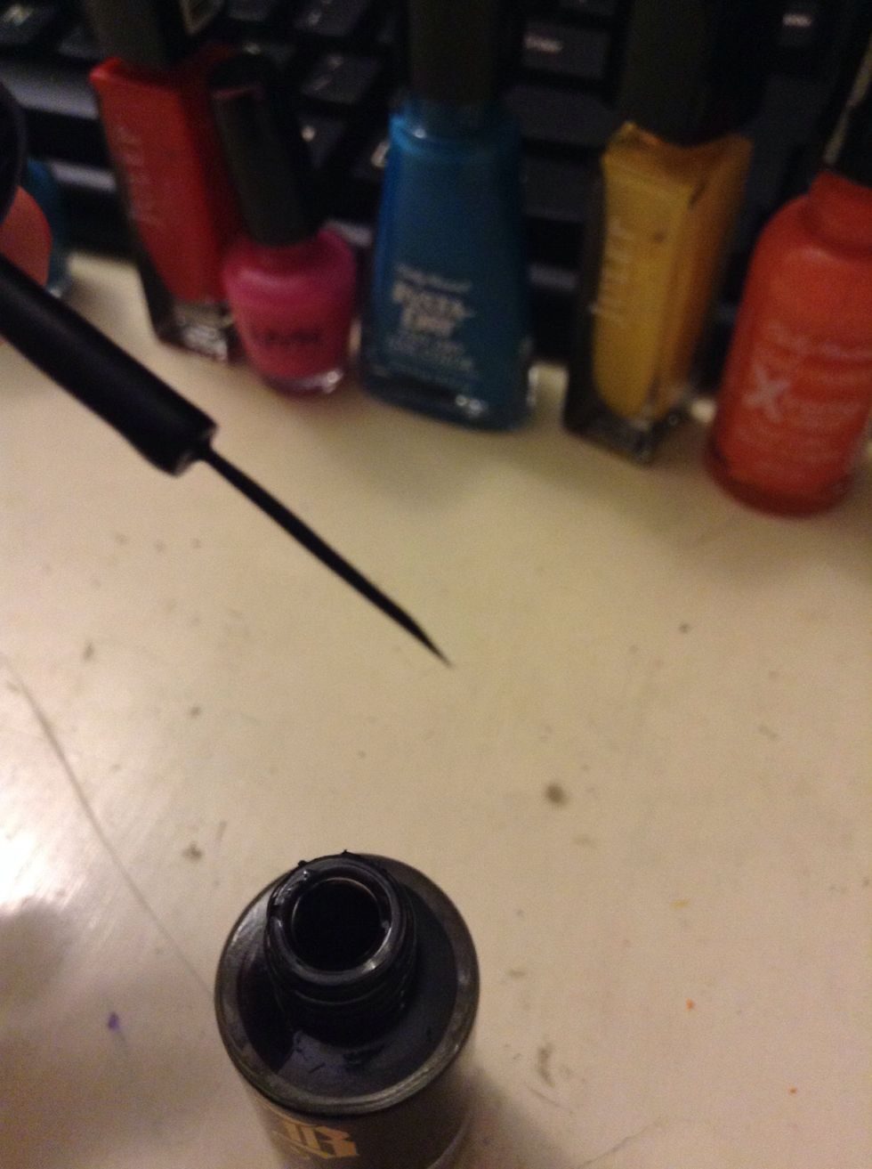Next you need a black striper/ nail art polish. I got this one for about $2 at Payless Shoe Store.