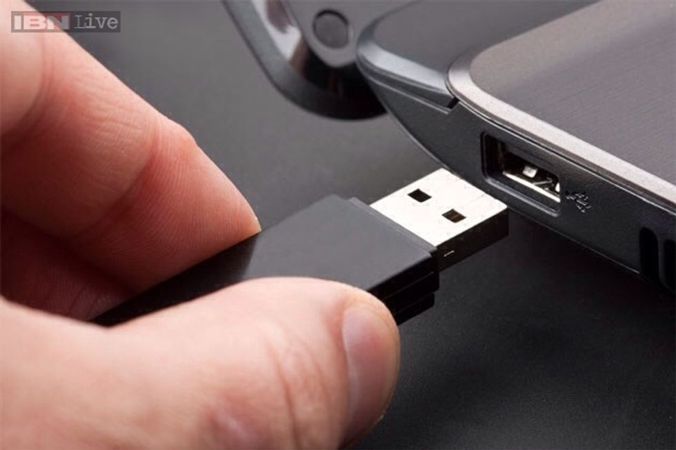 Next you need to look for the USB port in the side of your computer, when you do put the USB in with the two square holes facing upwards.