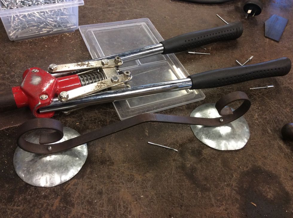 Next you need to pop rivet the two things at the bottom so then it will be able to stand.