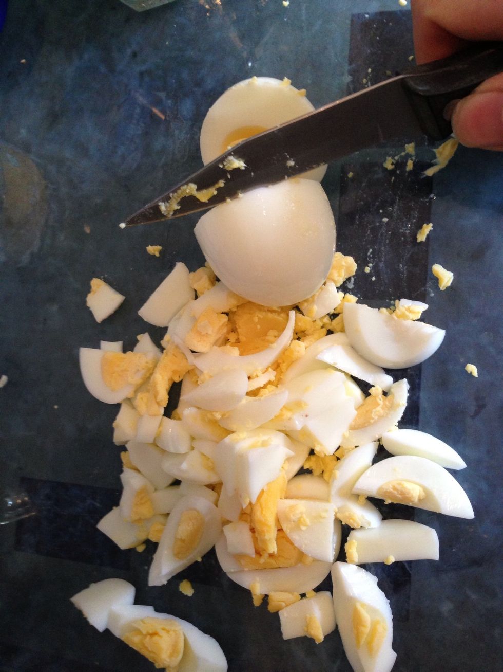 Next you need to roughly chop the eggs