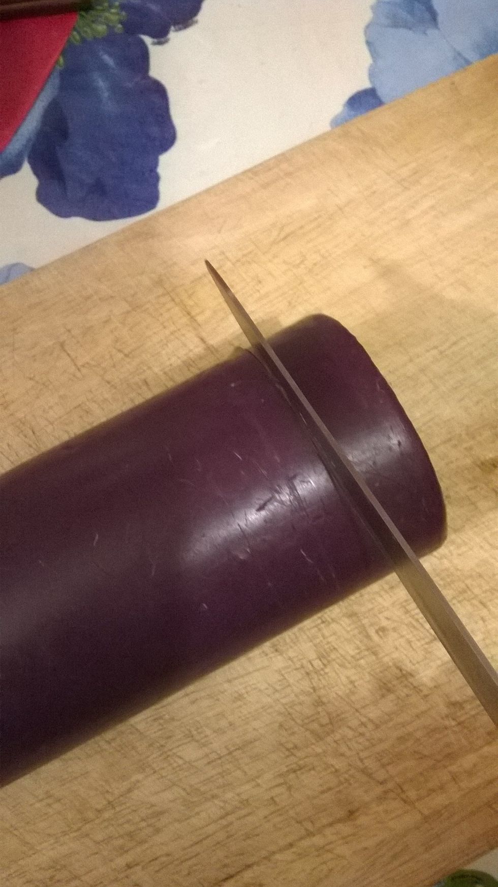 Next you need to start to cut into your candle with the knife. Try your best to keep the candlewick intact - don't worry if you do cut it, I'll tell you how to fix it later on.