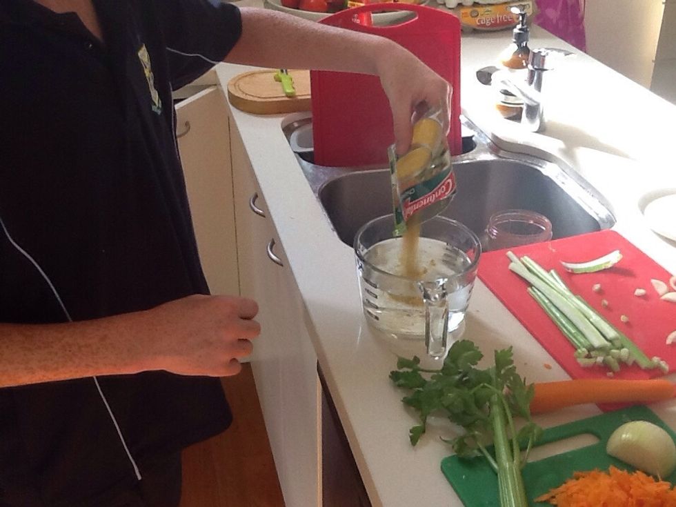 Next you put the chicken noodle powder in four cups of water