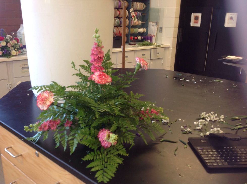 Next you take standard carnations and place them in order of tall, medium, and short.