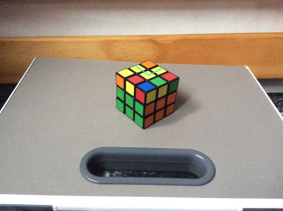 Next you will be getting the top plus. Turn the whole cube so that it has a "L" on the top.