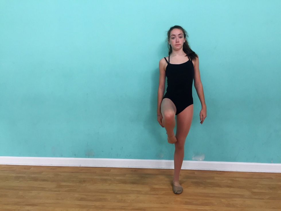 Next you will continue with lifting your right leg creating a straight line from your hip to your knee, and connecting your left toe to your knee