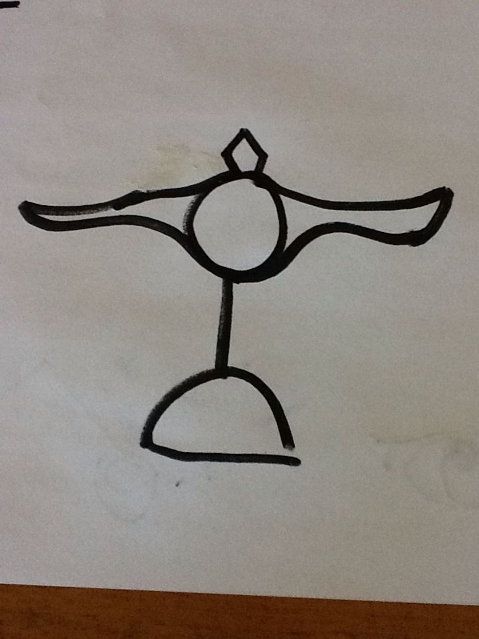 Next, you will draw in the arms which stretch across the paper like so. They are curved slightly and in the center there is a pointed spear like tip
