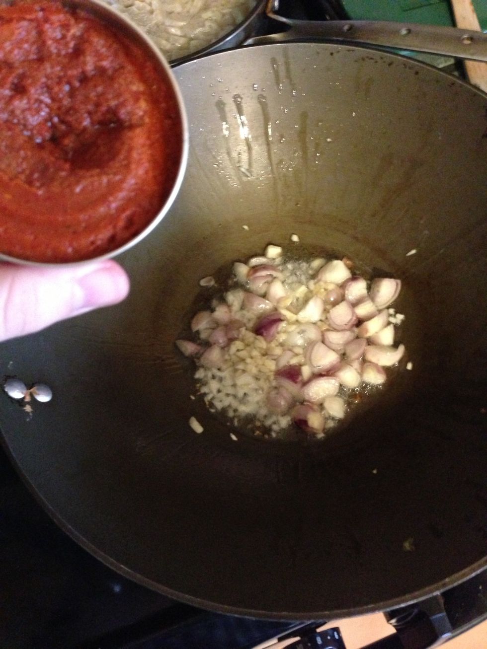 Next you will need to add the curry paste. I only use half. If you use the whole can you're going to need more coconut milk. Spice city. Bombs away.