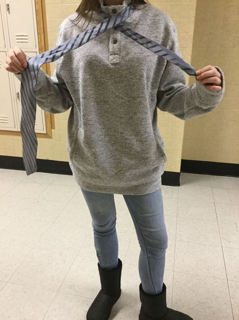 Next, you will need to bring the large side OVER the smaller end. The fat side should now be on our right and the skinny on the left.