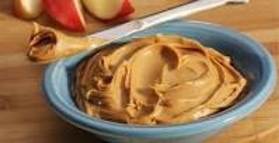 Next You will need to get the Peanut Butter and Butter Knife; Likewise Dip the knife into the Peanut Butter. After you do that take it out and put the Peanut Butter on the Bread.