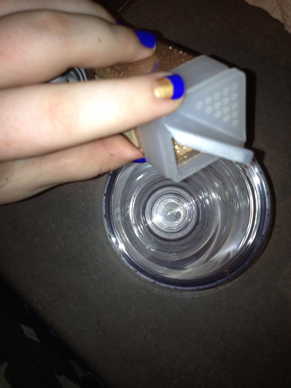 Next (you will need to move quickly) power as much glitter as you see fit into the cup. Cover the top and shake. This process will be fast so don't waste anytime!