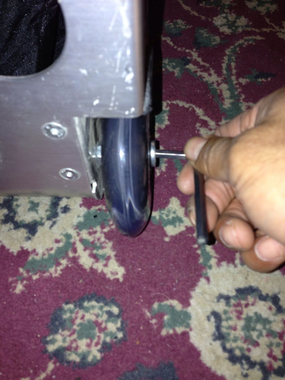 Next you will ONLY need the Allen Key to secure and lock the axel to the wheel housing by turning it anti-clockwise for the right wheel, and clockwise for the left wheel.