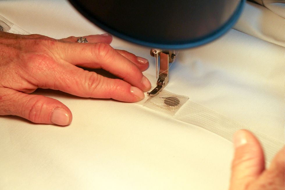 Next, you will stitch the tabs above the magnet. Here's a close up. I back stitched the entire seam. Be sure and use a thread that matches well.