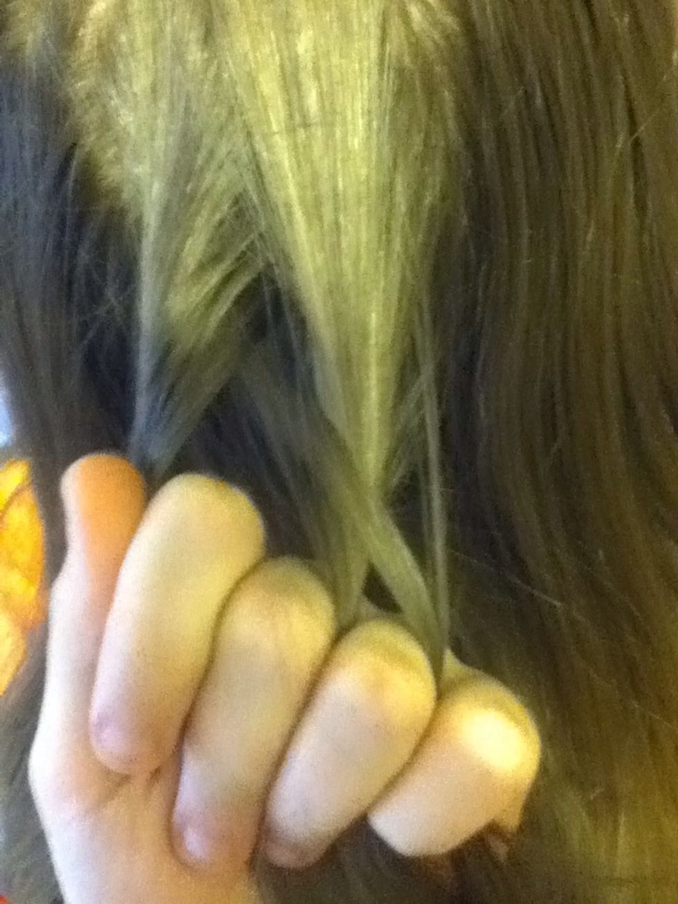 Next, you will take the 3rd piece, and pull it under the middle piece. Making it the new middle piece.