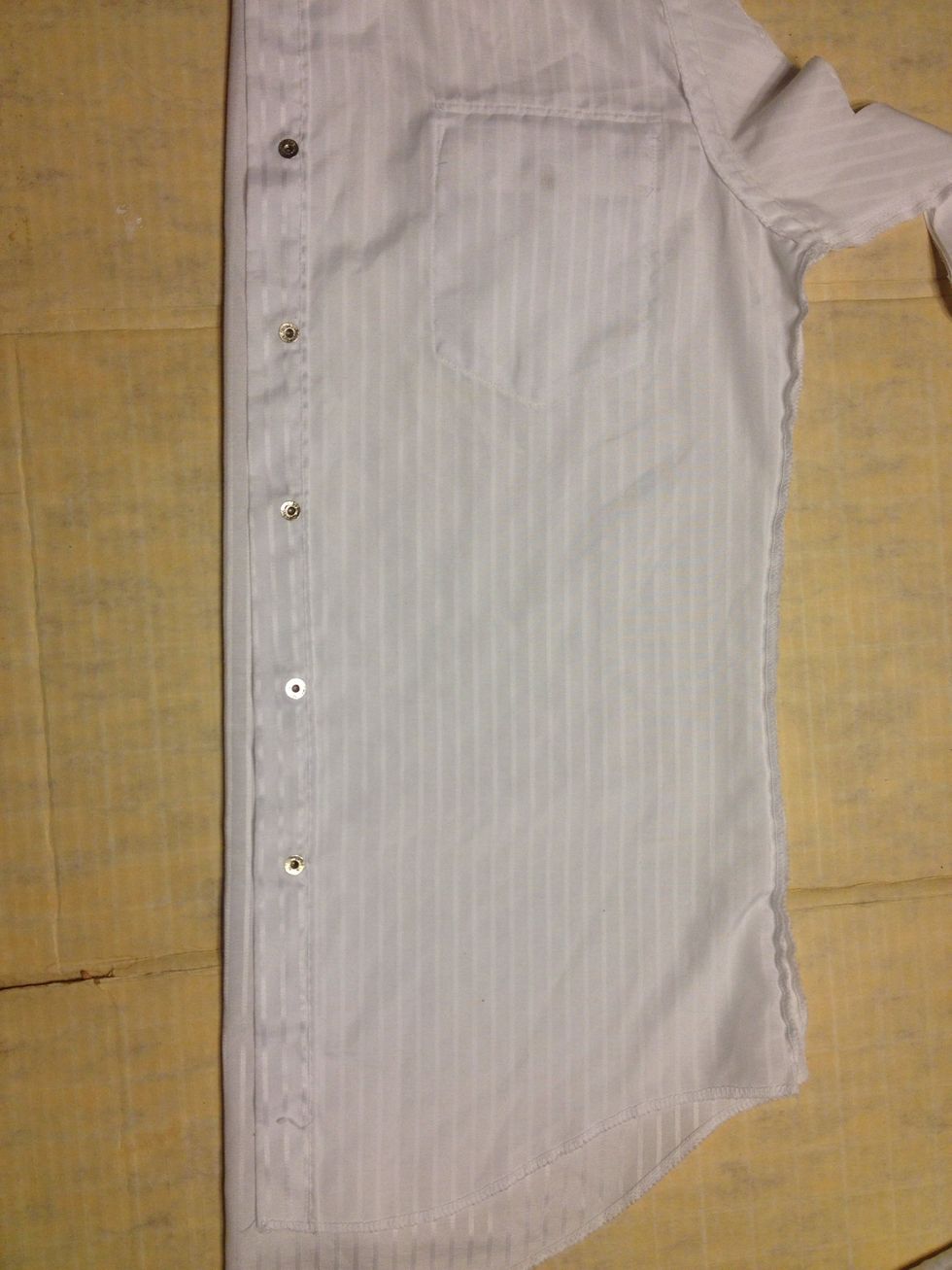 Next! Your shirt should still be folded like this. Make sure it is smoothed out.