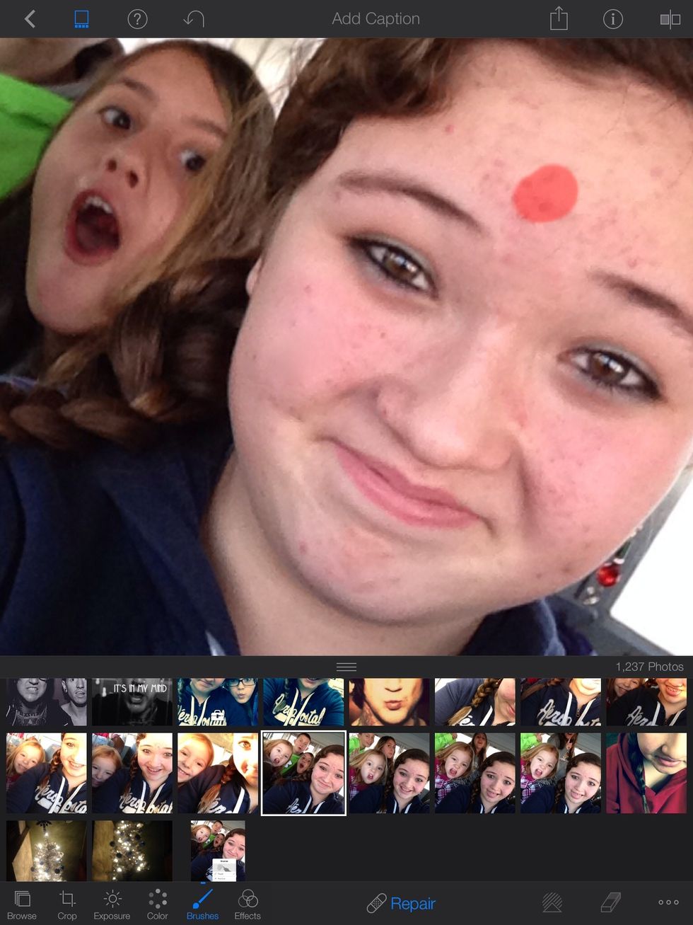 Next, zoom in on your face and stroke the areas where the blemishes are.