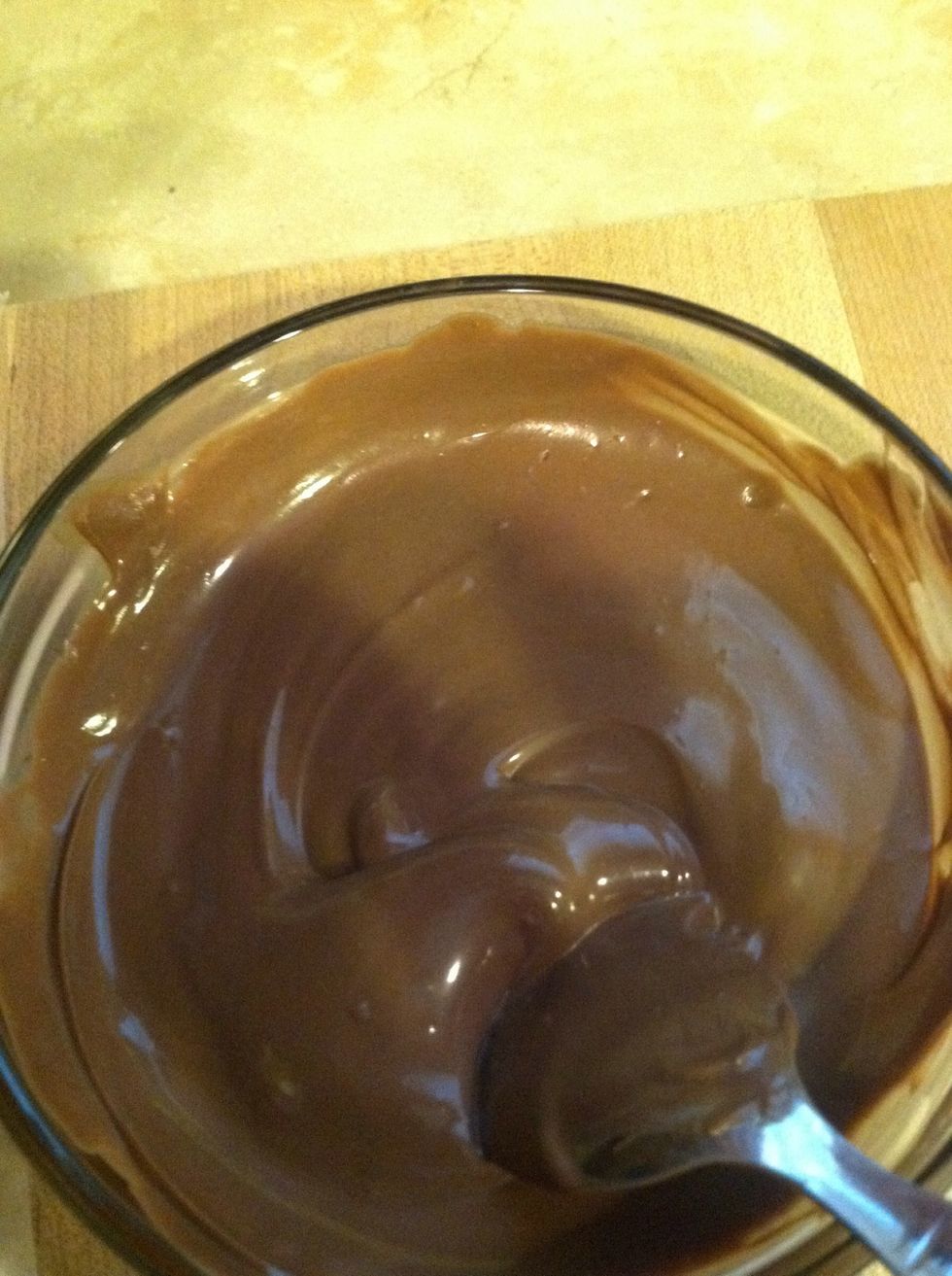 Nice and smooth, now we r ready to dip strawberries, grab strawberry through toothpick and cover with chocolate just the top side.