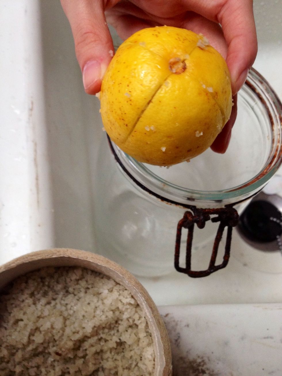 Nick lemons crosswise and fill the slots with salt. Put 20 g of coarse salt in the bottom of a glass jar (previously boiled) and pack the lemons in it.