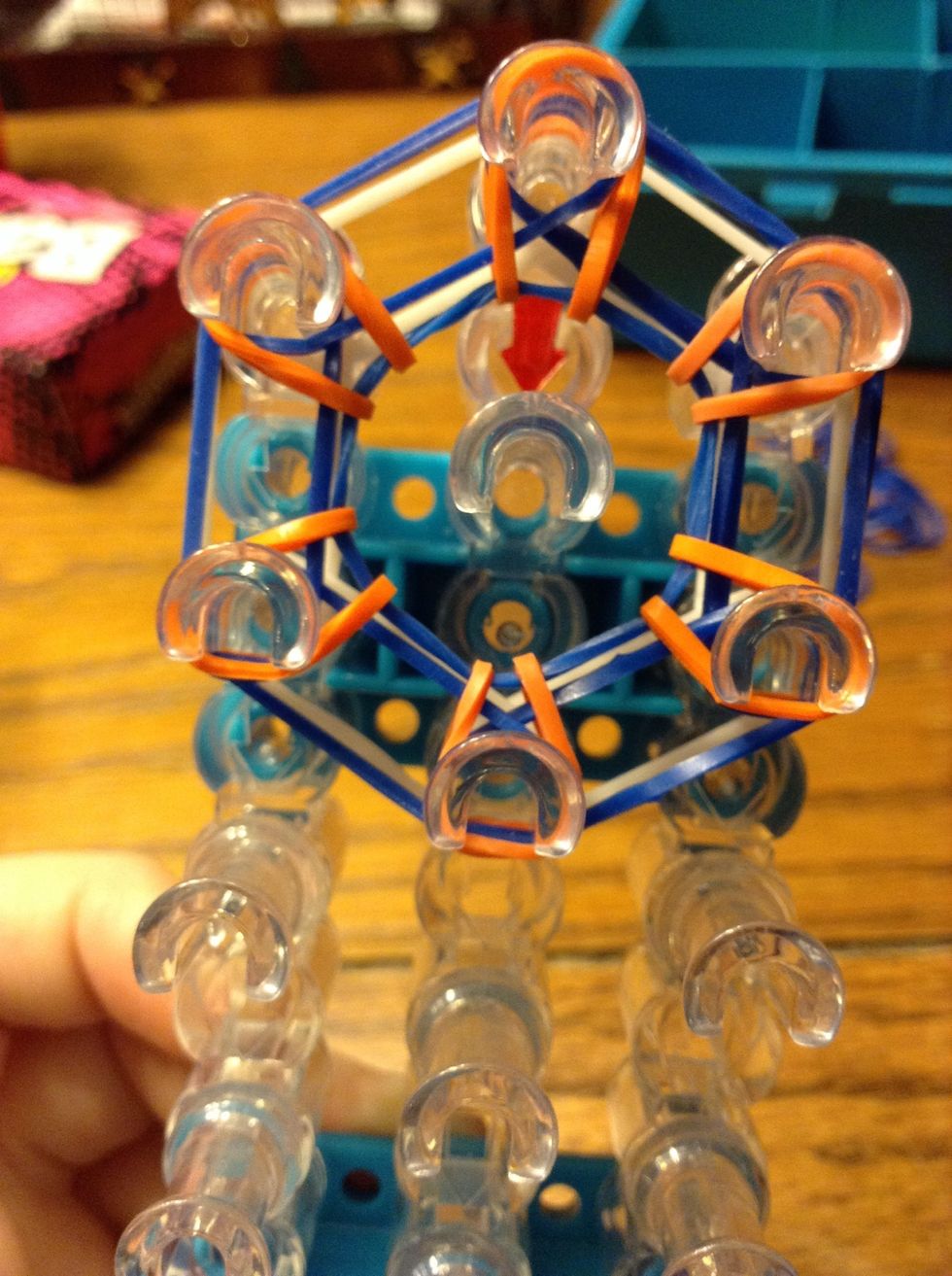 No bands should be on the middle peg now.