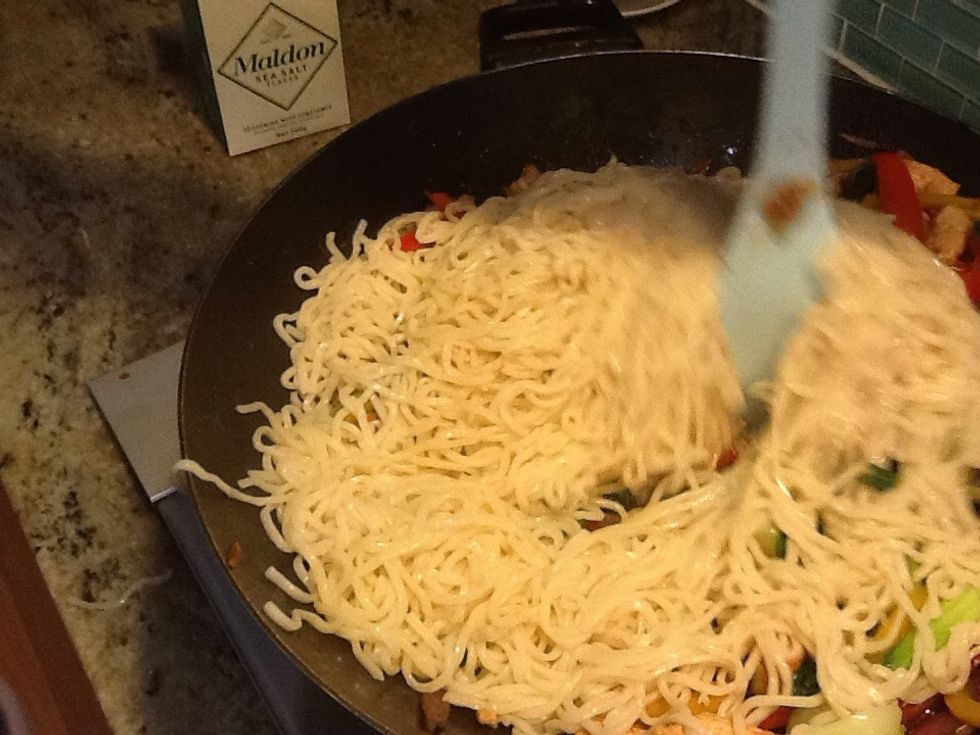 Noodles should be cooked by now, add them to the wok