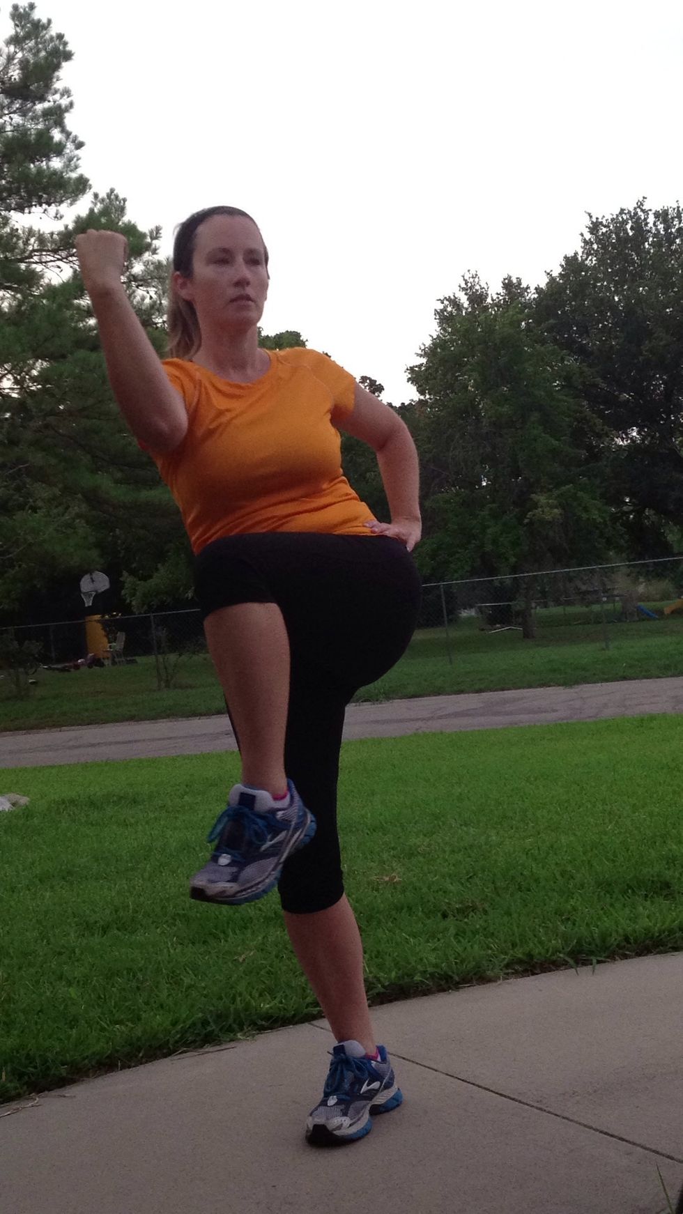 Nope, my elbow doesn't touch my knee. Keep your back tall, don't hunch over. It's more about the twist and raising the knee than trying to make the elbow and knee touch!