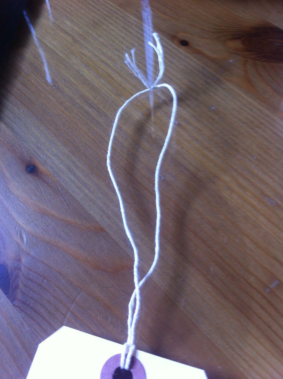 nope tie a knot in the top of the string on the label.