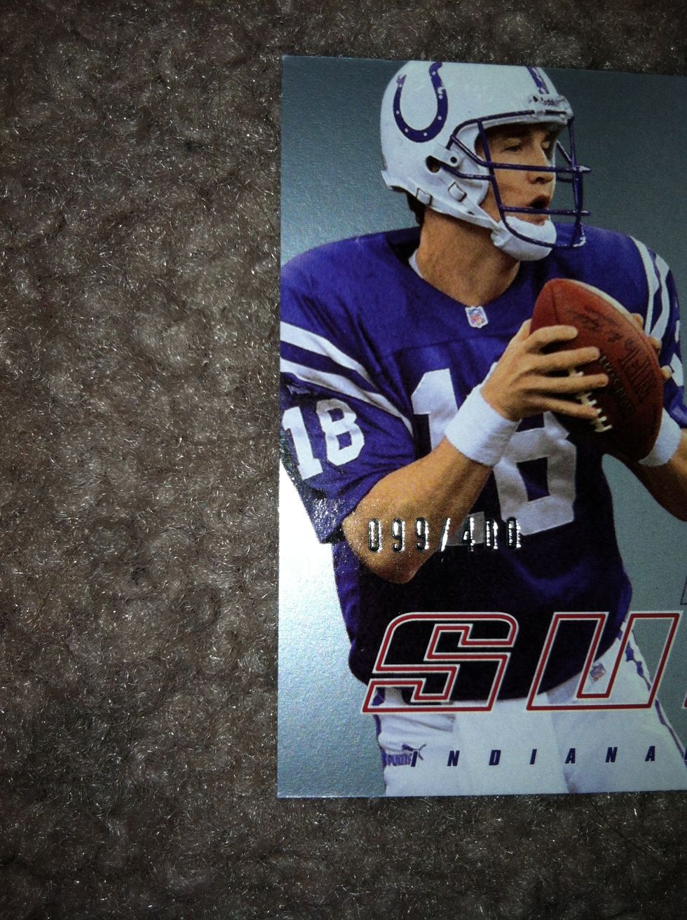 Not all cards are numbered like this. This one is, as you can notice on the front. Labeled in silver print it states "099/400". This means this was the 99th card produced out of 400.