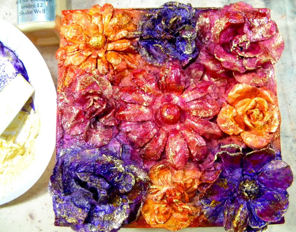 Not done yet!  A touch of Metal Effects Gold will bring out all of the texture created by layering all of mediums.   I used my finger to add it to the petal edges and flower centers.