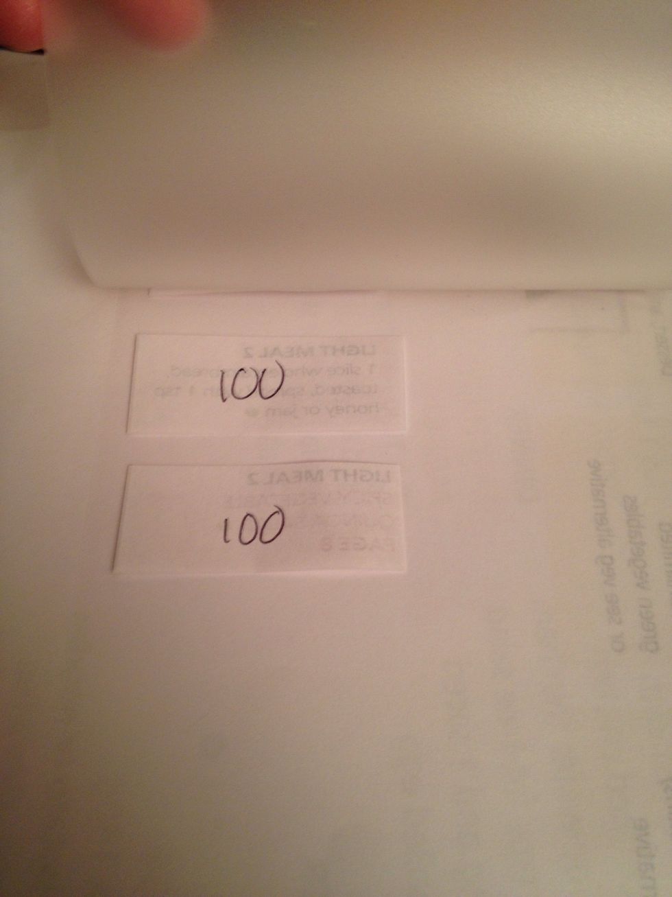 Not easy to see but am putting the meal strips into a laminating pouch