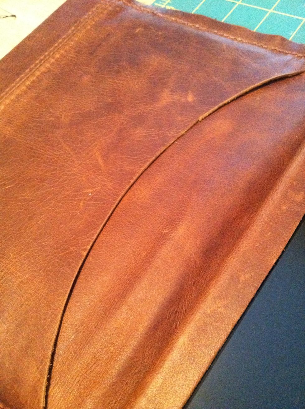 Not its time to trim the inside leather flap. I trimmed it about 3-4 inches in. You can use this pocket to hold papers and cards.