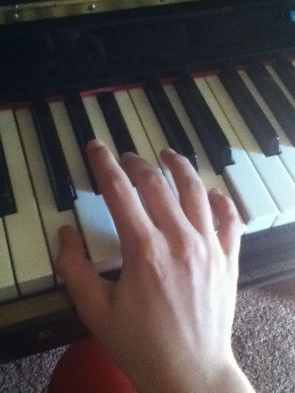 Note: in this picture, the notes are all played at the same time, but that is incorrect. You will play the notes in this order: D followed by a B flat, followed by an F. (Pinky, to middle, to thumb)