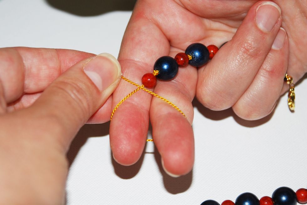 NOTE: Just like in step 18, you have the option to skip the knot after the last stone, and go straight to your end cap - or you can make a knot after your last stone as I did here.