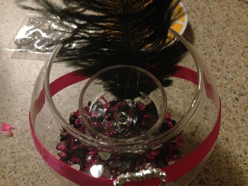 Note the location of the feather placed in behind the heart.