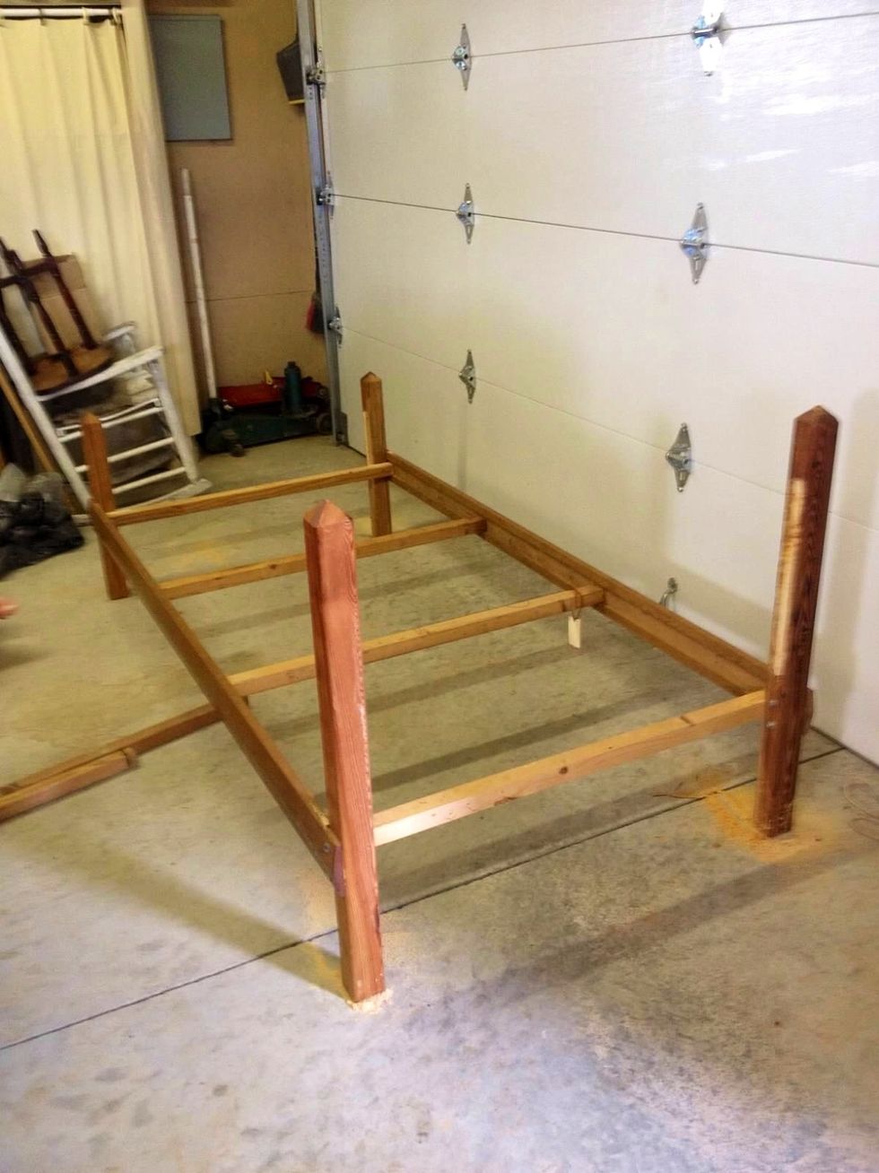 Note: This project cost me under $100 to make because I designed it by things I already had around the house. First: I cut the head and foot board off of this old bed frame I had.