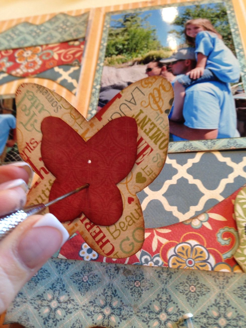 Note: To make it easier to add brads to your page, first poke a little hole through the paper.