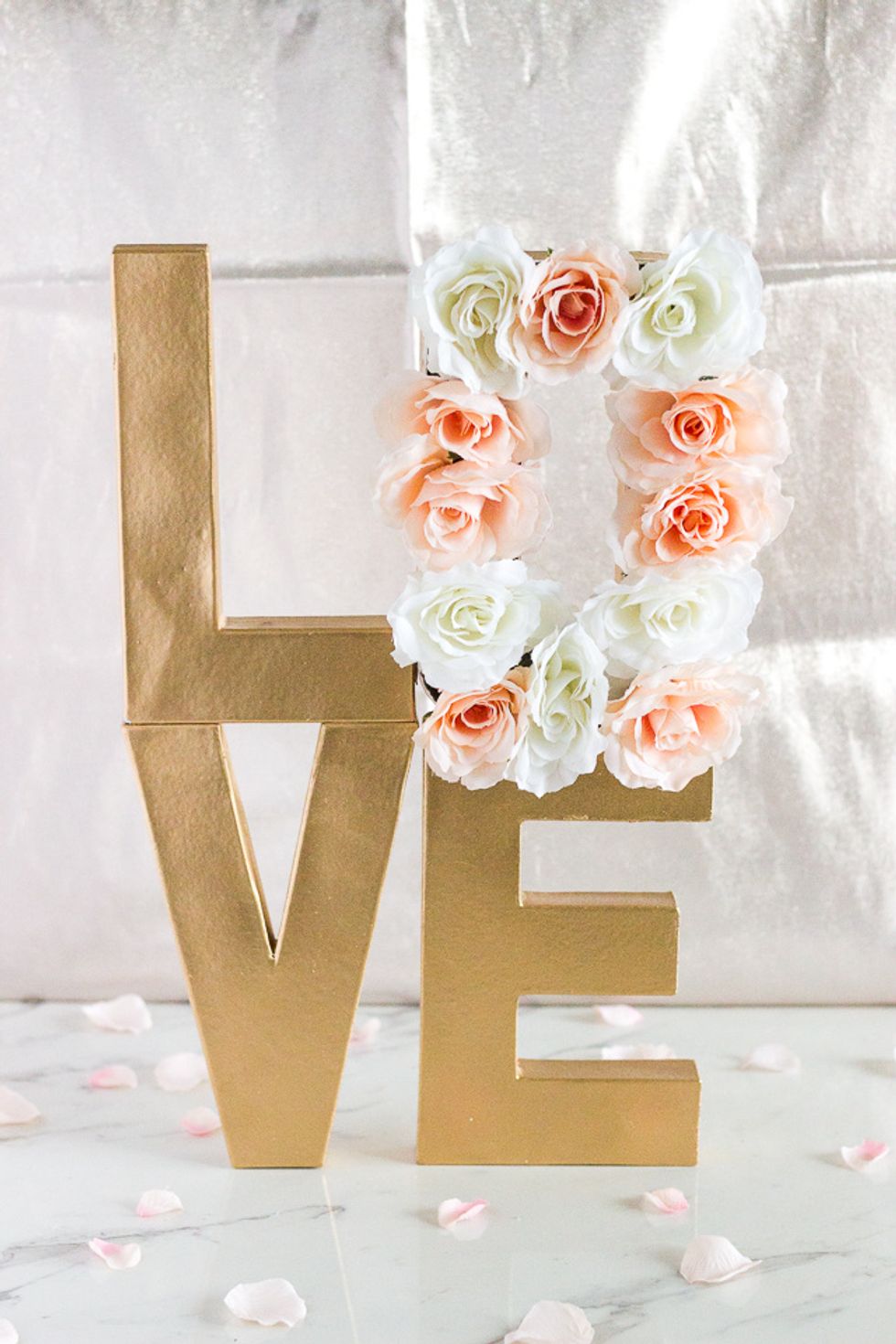 Nothing makes me smile more than the sight of beautiful flowers and with paper mache letters being a being trend lately, I decided to create this pretty floral letter centerpiece