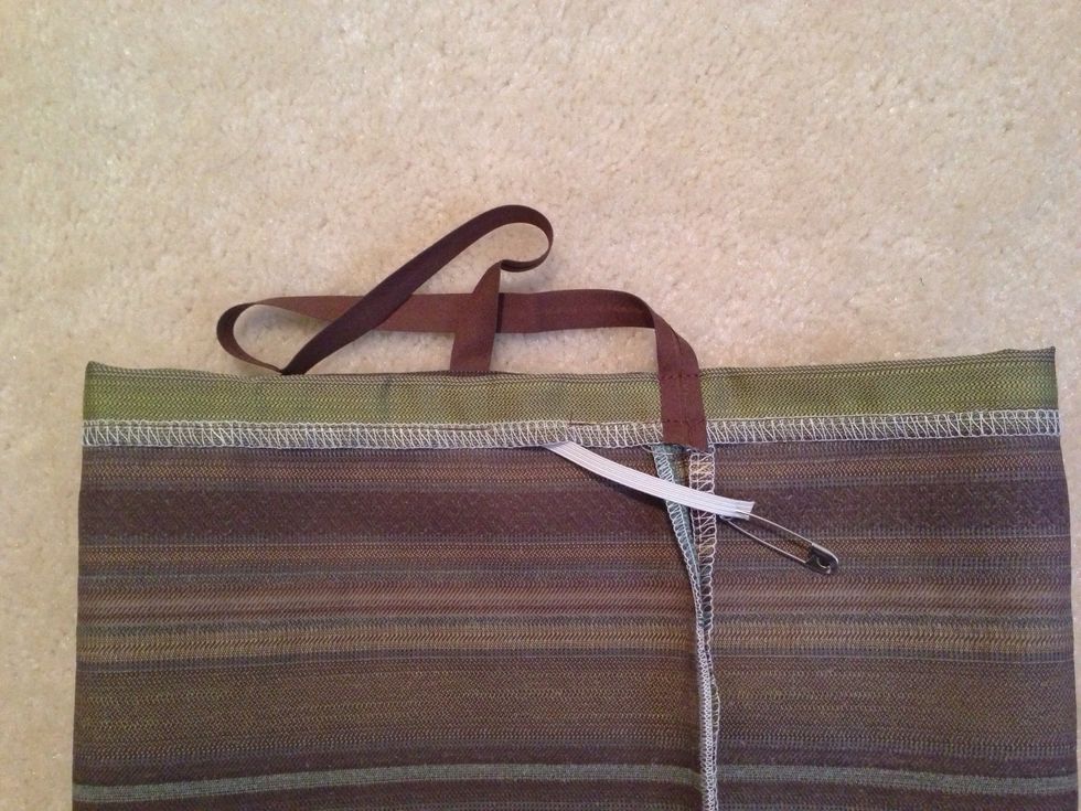 Notice bias tape has 2 stitch lines. Leave 1/2" gap NOT sewn for elastic entry. Guide elastic through loop with safety pin.