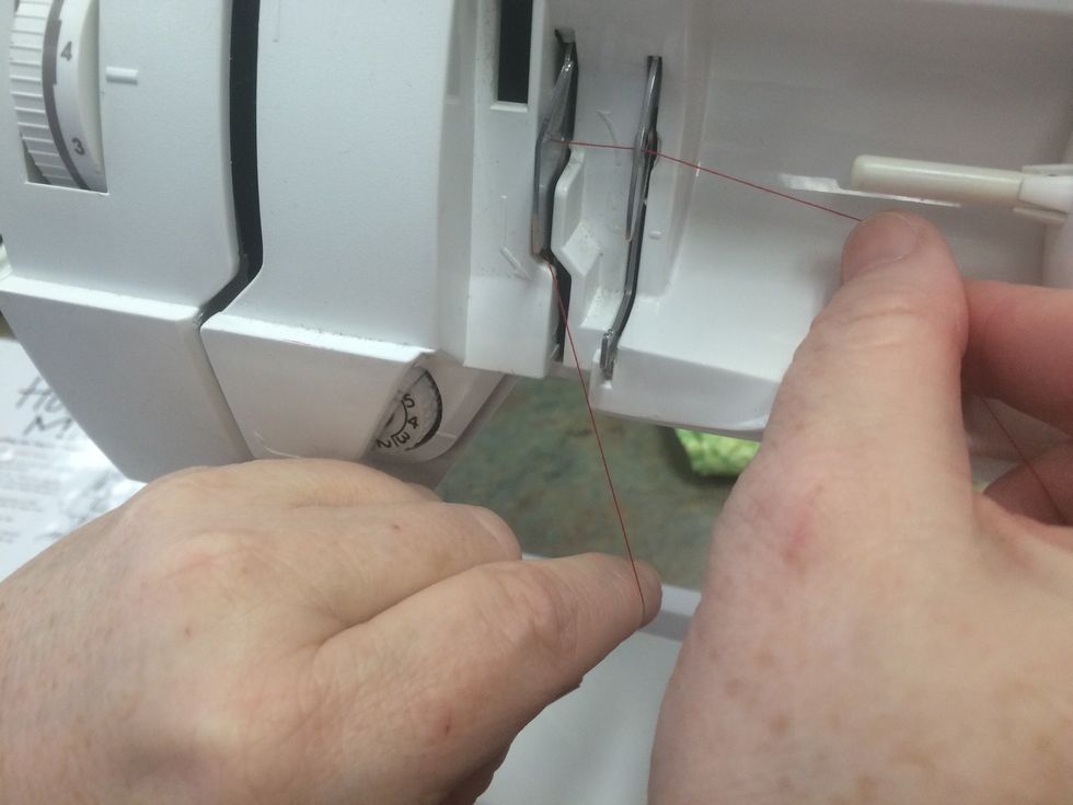 Notice the arrows show you where the thread should go