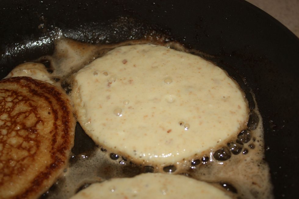 Notice the bubbles starting to come through. This is the first sign that the pancakes might be ready to flip. Also notice the edges are starting to look cooked.