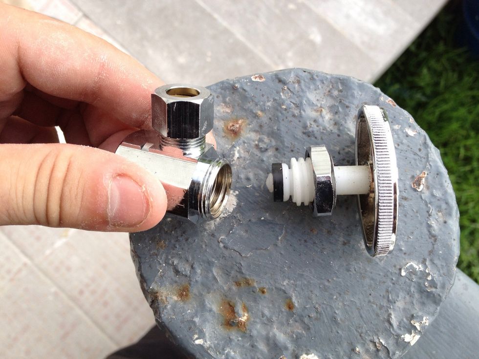 Notice the little rubber washer on the end of the threaded plastic plunger. That's what is most likely missing or damaged on the old valve we are about to replace.