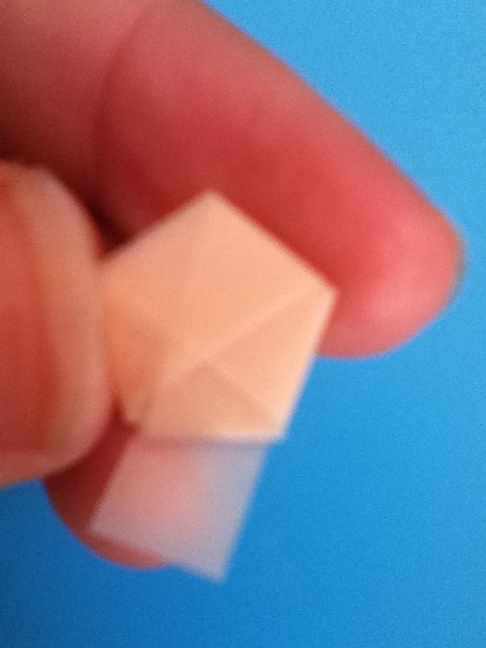 Notice the triangle shaped pocket formed by the overlapping paper. ( sorry about the blurry picture)