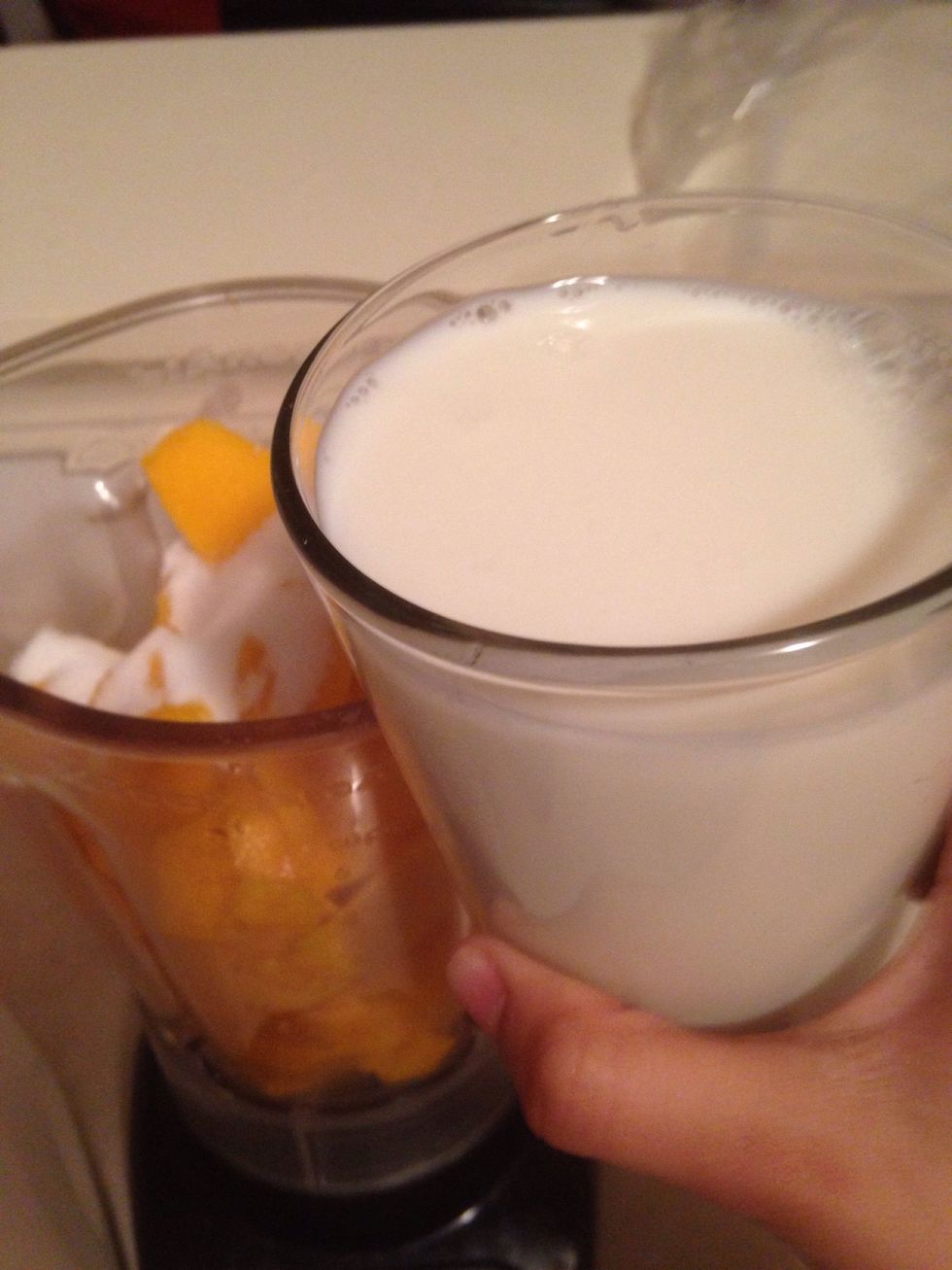 Now add 1 1/2 glasses of milk in the blender