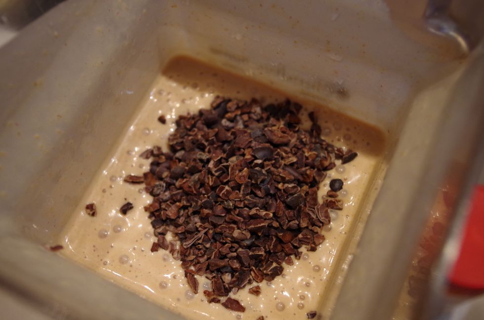 Now add 2 tbsp cacao nibs, and blend about 15 seconds until the cacao nibs are broken down just a little to add some texture to your smoothie.