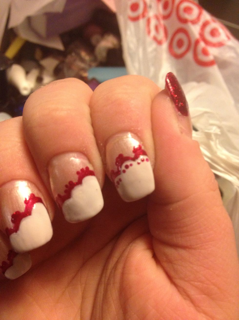 Now add 3 red dots to the top center of each white line.